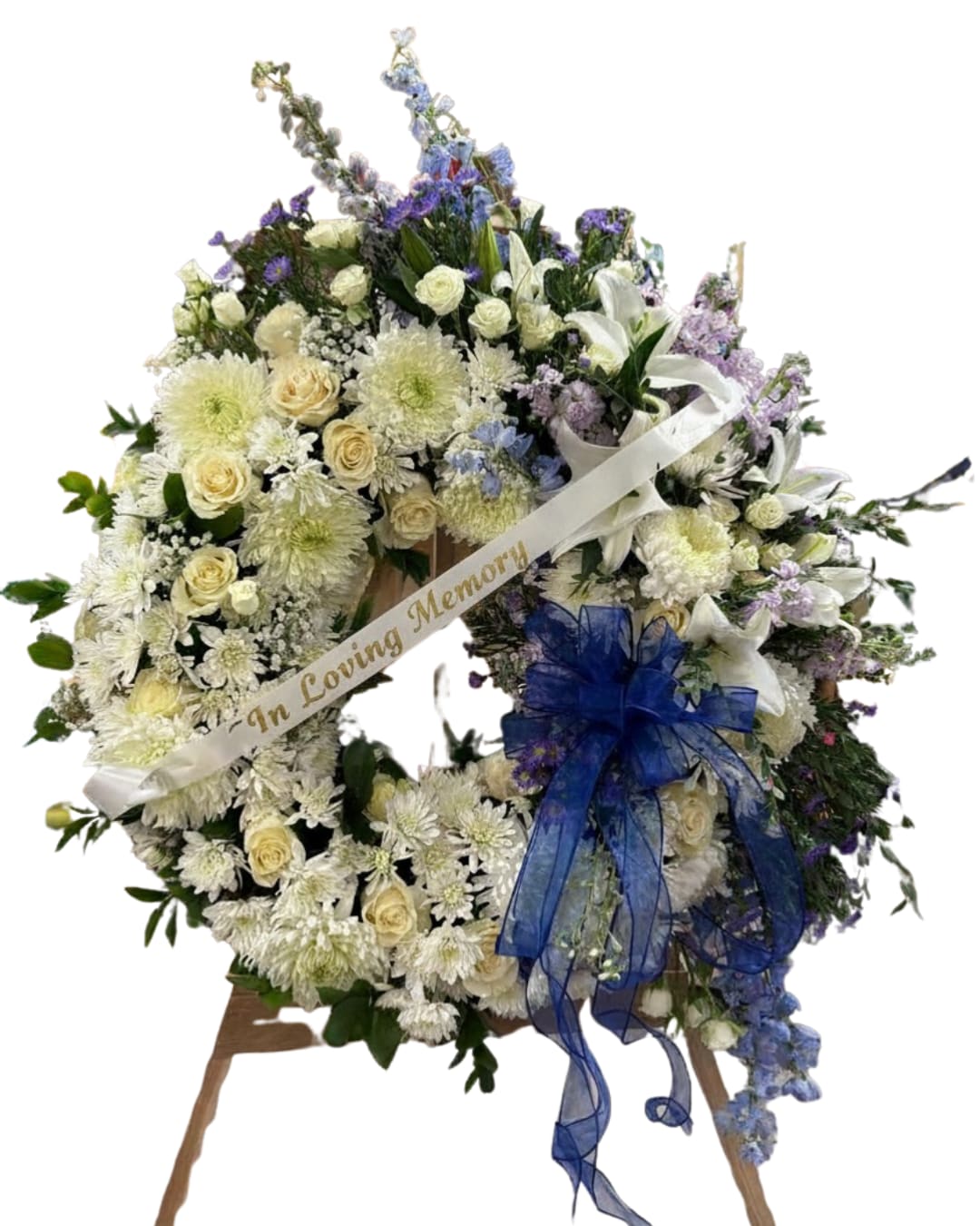 "Whisper of Peace" Flower Wreath - A delicate floral wreath designed to convey calm, love, and a message of comfort during the most sensitive times. “Whisper of Peace” combines fresh flowers in soft, harmonious tones, carefully selected to reflect serenity, respect, and a luminous tribute.  Every detail of this wreath evokes a silent embrace, a gesture of support, and an elegant tribute to honor the memory of a loved one.  Perfect for expressing your condolences with sensitivity and beauty, carrying a message of peace that will remain in the heart.