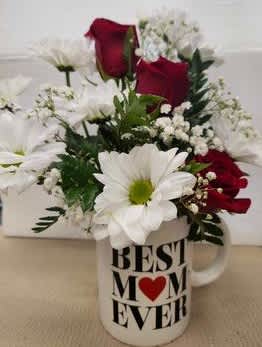 Red roses and white daisies arranged in a "Best Mom Ever" mug.