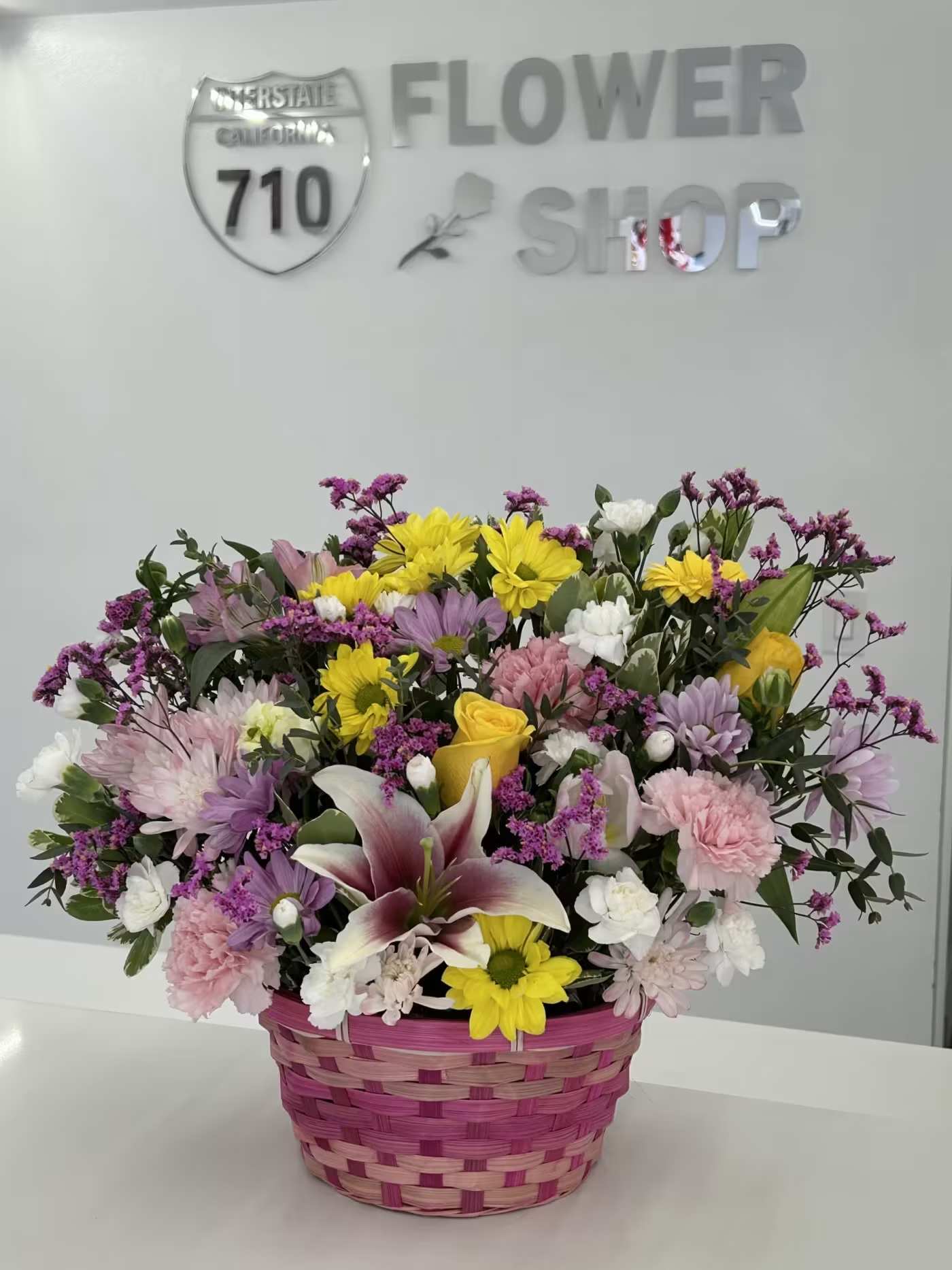 Garden Basket - Bright, joyful, and full of seasonal charm, Garden Basket captures the beauty of soft blends of pastel tones is paired with cheerful pops of color, creating a fresh and uplifting arrangement that feels both playful and elegant. Designed in a woven basket, it brings a warm, garden-inspired touch to any space—perfect for Easter celebrations, thoughtful gifting, or welcoming the new season with style. (If some flowers and/or the vase are not available there will be minor substitutions.)