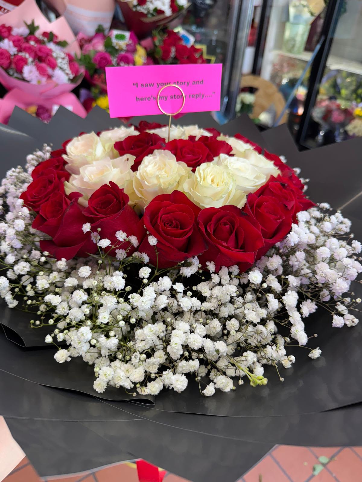 Cloudy Red &amp; White Jumbo Arrangement - A beautiful red &amp; white arrangement made up with red &amp; white roses with a cool cloudy look made up of baby breath.