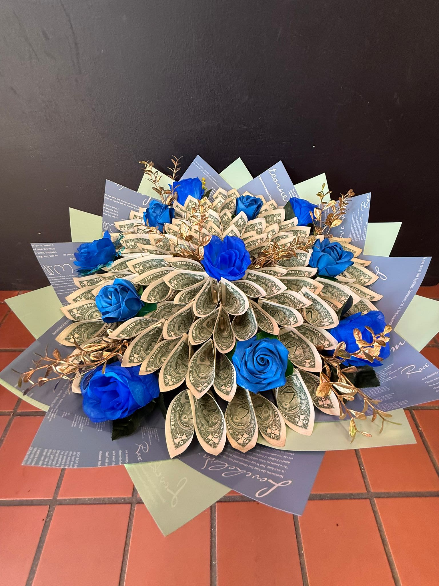 Blue &amp; Gold Money Bouquet ($100 in 1 dollar bills) - Show that special someone you love them more than flowers can express with this money bouquet not only made up of 1 dollar bills but also artificial flower to make this bouquet last and pop for whoever receives it!