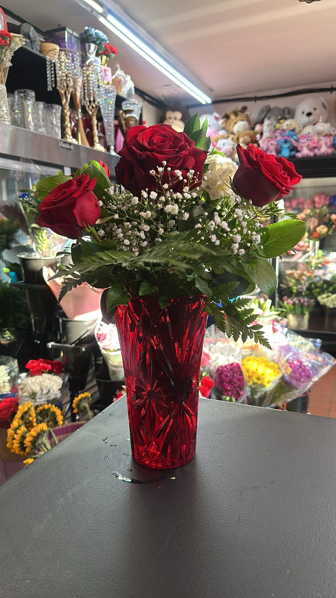 1/2 Dozen Roses in a see-through red vase - Perfect to add a touch to your home or someone else's home you cherish!