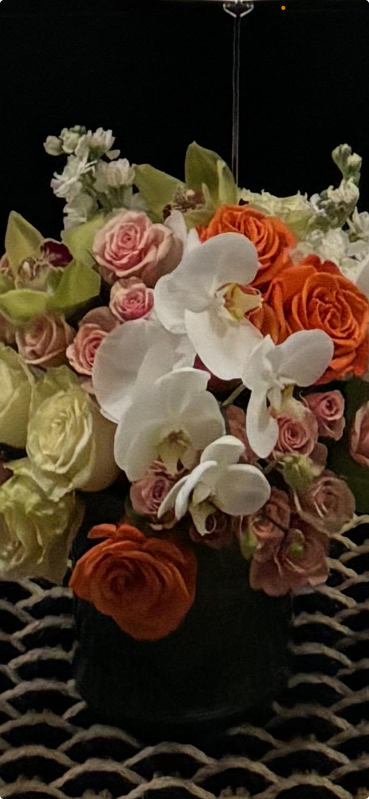 Blushing Grace - A bouquet with soft pink roses and white orchids, exuding a gentle, romantic vibe.