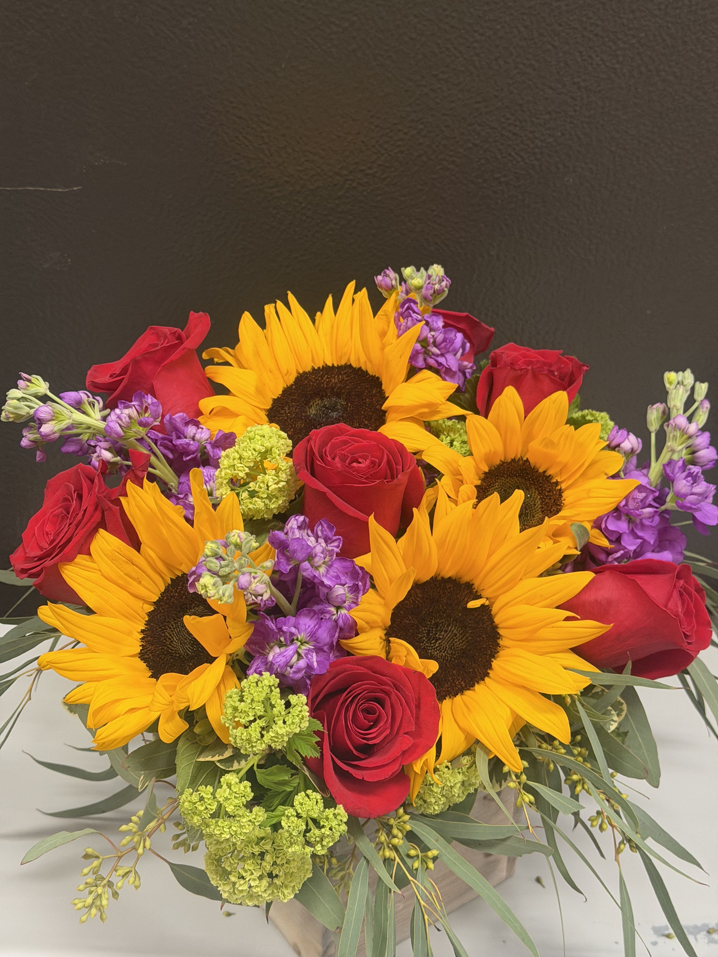 Sunshine and Sweet Arrangement  - This beautiful arrangement made with sunflower, red roses and purple stuck in a wooden box 