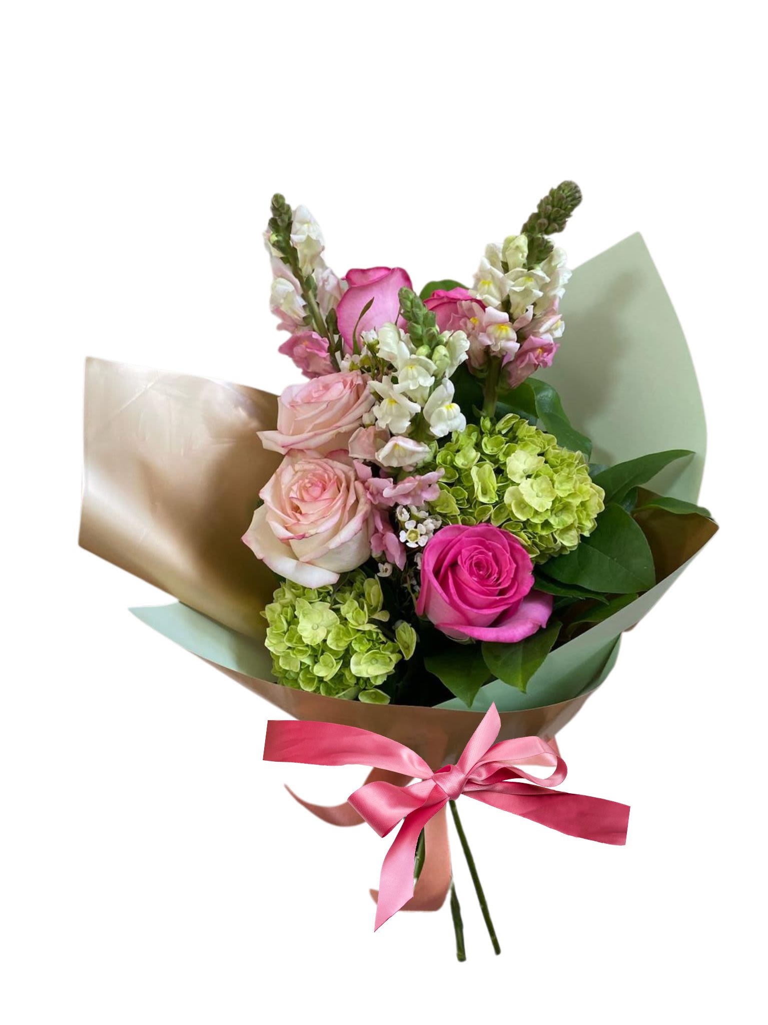 Hand-tied bouquet of pink roses, white snapdragons, and green hydrangeas wrapped in paper with a pink ribbon.