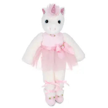 Stuffed white unicorn doll wearing a pink dress and matching shoes.