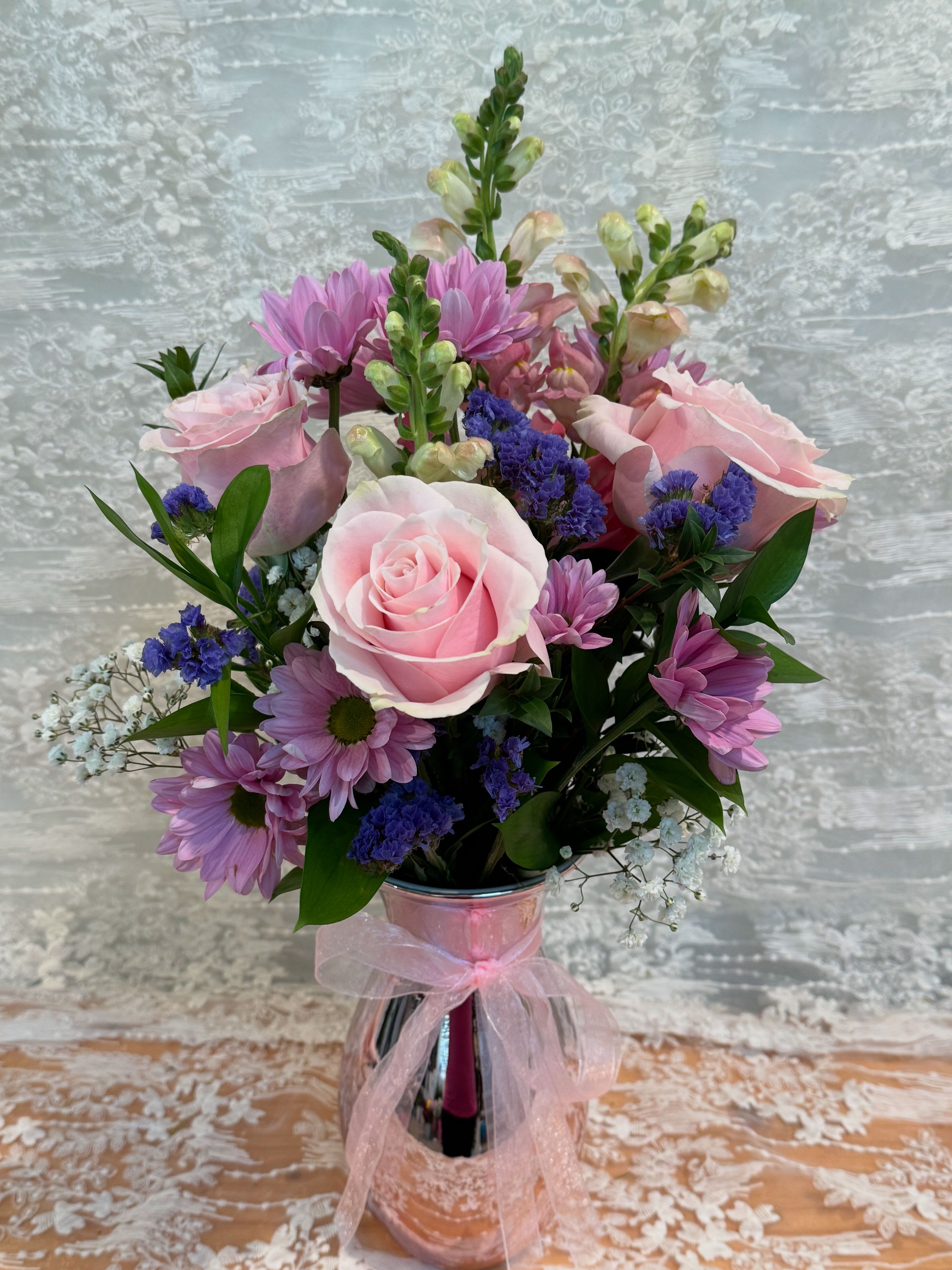 Pretty in Pink - Arrangement filled with light pink roses, spray daisies and snapdragons. 
