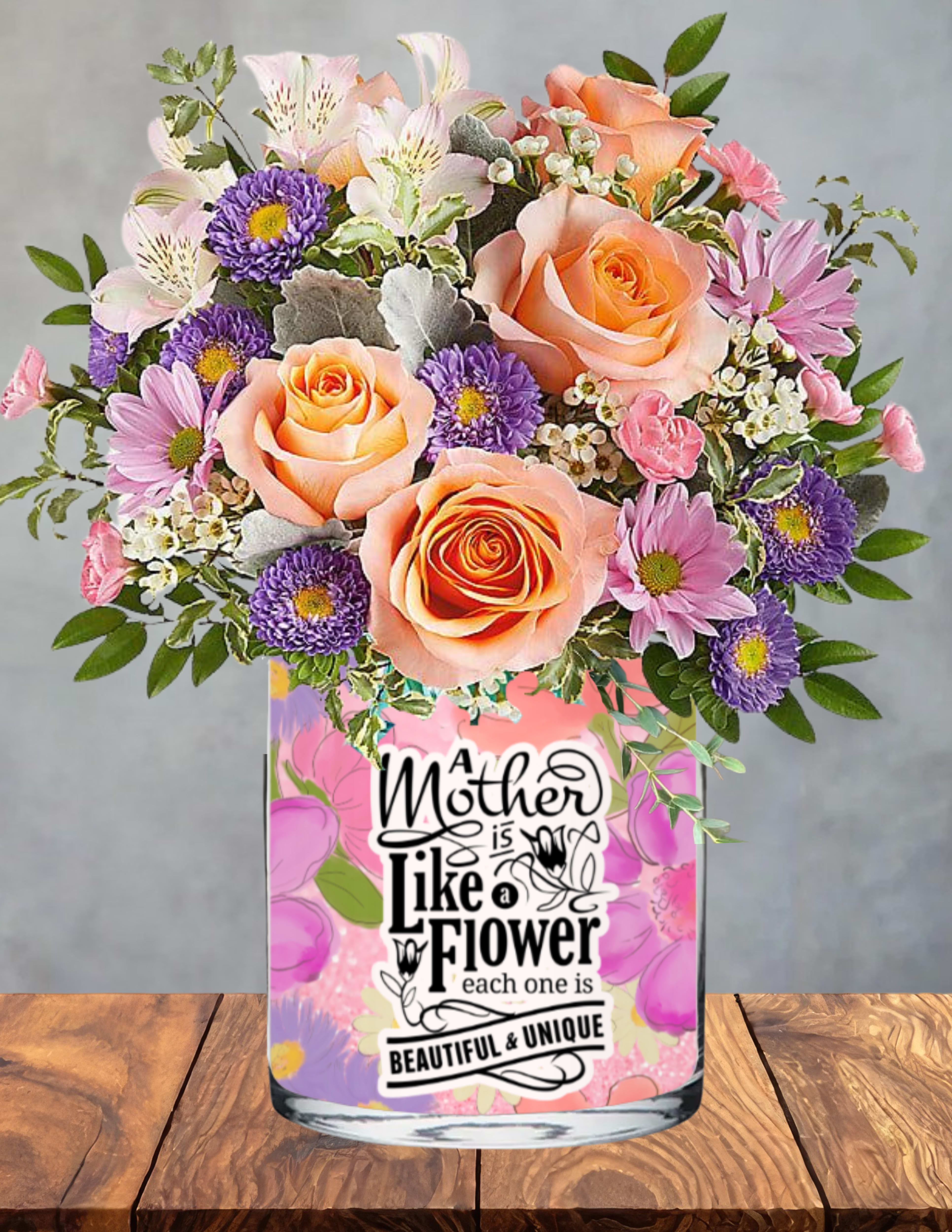 Mom’s Pastel Garden - A soft, joyful garden moment created to honor the beauty only a mother brings.  Mom’s Pastel Garden blooms with peach roses, lavender asters, pink daisies, and white alstroemeria, all gathered into a gentle, airy mix that feels like spring sunlight in floral form. Each pastel bloom adds its own note of gratitude — for her kindness, her strength, and the way she makes life feel brighter just by being in it.  Nestled in a charming vase printed with the sentiment “A Mother is Like a Flower — Each One is Beautiful &amp; Unique,” this arrangement becomes both a tribute and a keepsake. It radiates warmth, appreciation, and the tender joy of celebrating the woman who means so much.  A lovely choice for the mom who deserves to feel seen, cherished, and beautifully unique.