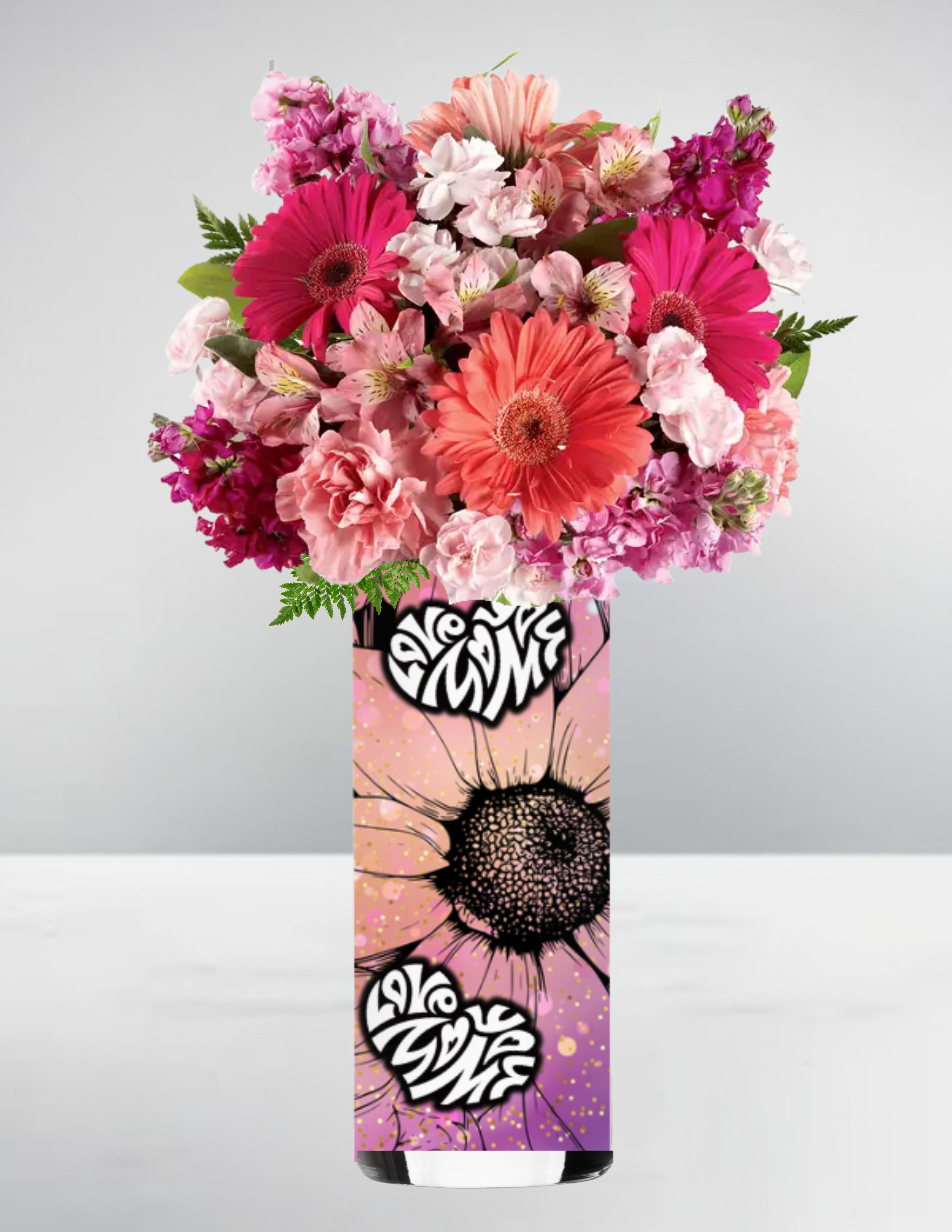 Tall arrangement of pink and coral gerbera daisies and mixed blooms in a graphic art vase