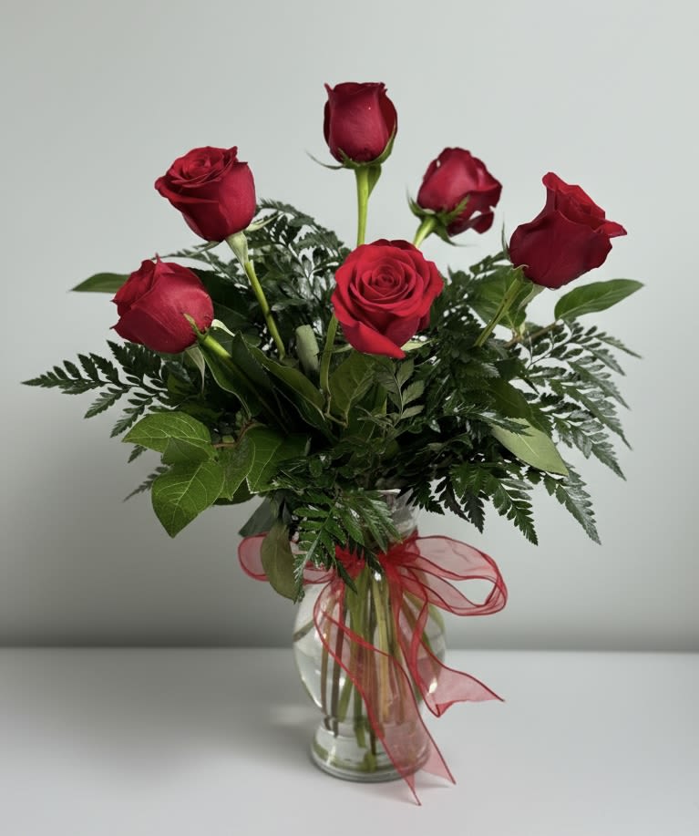 Half Dozen Red Roses - Keep it classic with our premium red roses. Six of them, arranged with two greens in a simple vase. 