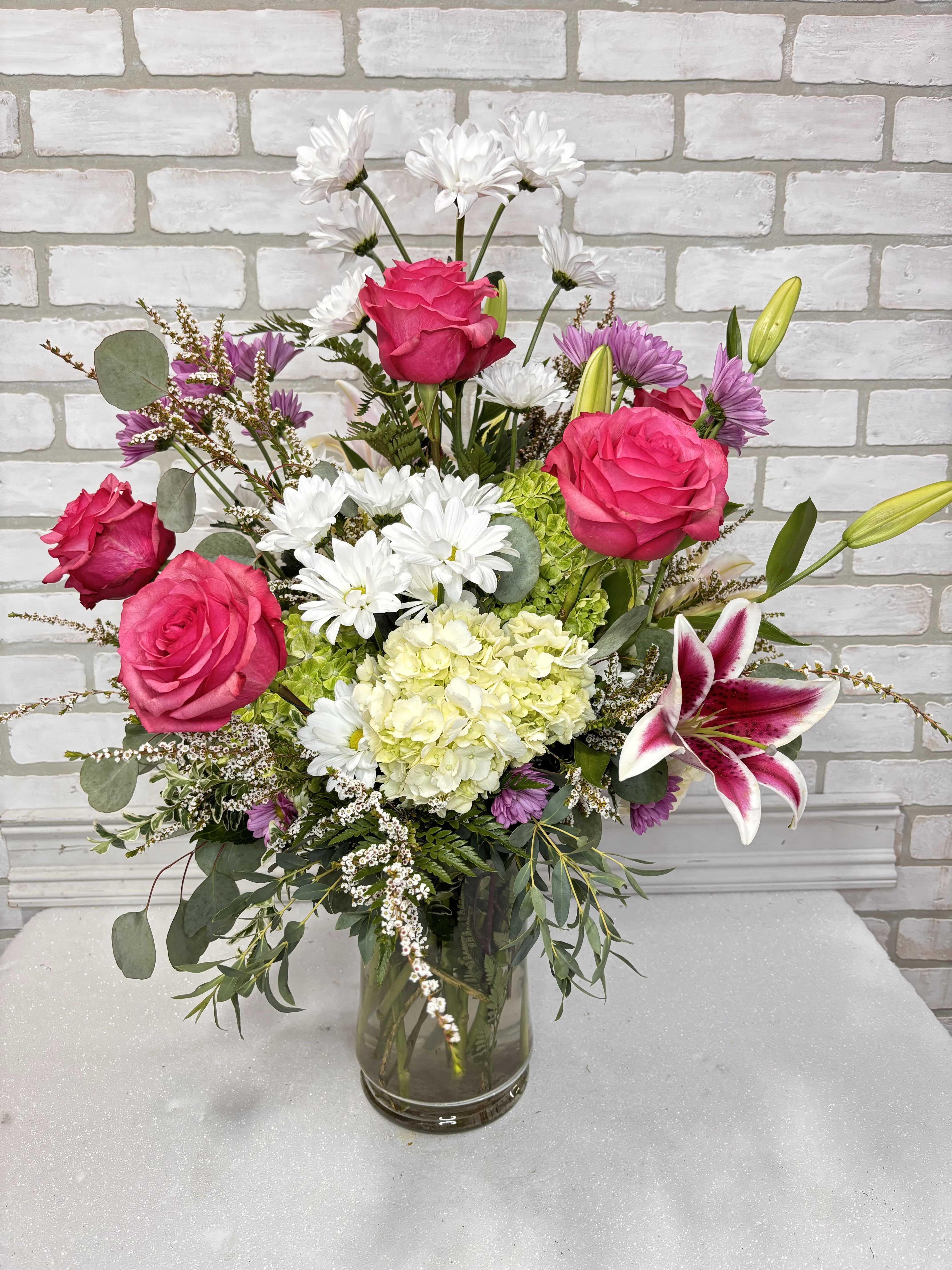 Humbling Heather - A grand arrangement with hydrangea, stargazer lilies, roses, and daisies, 