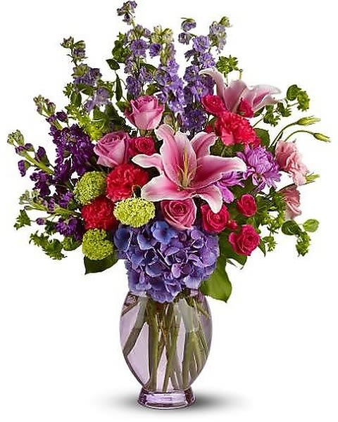Beauty n' Bliss - This abundant and colorful bouquet is like a stroll through a garden in full bloom. Bursting with two feet of fresh pink lilies, light purple dahlias, purple hydrangea and pink roses that is sure to brighten anyone's day. 