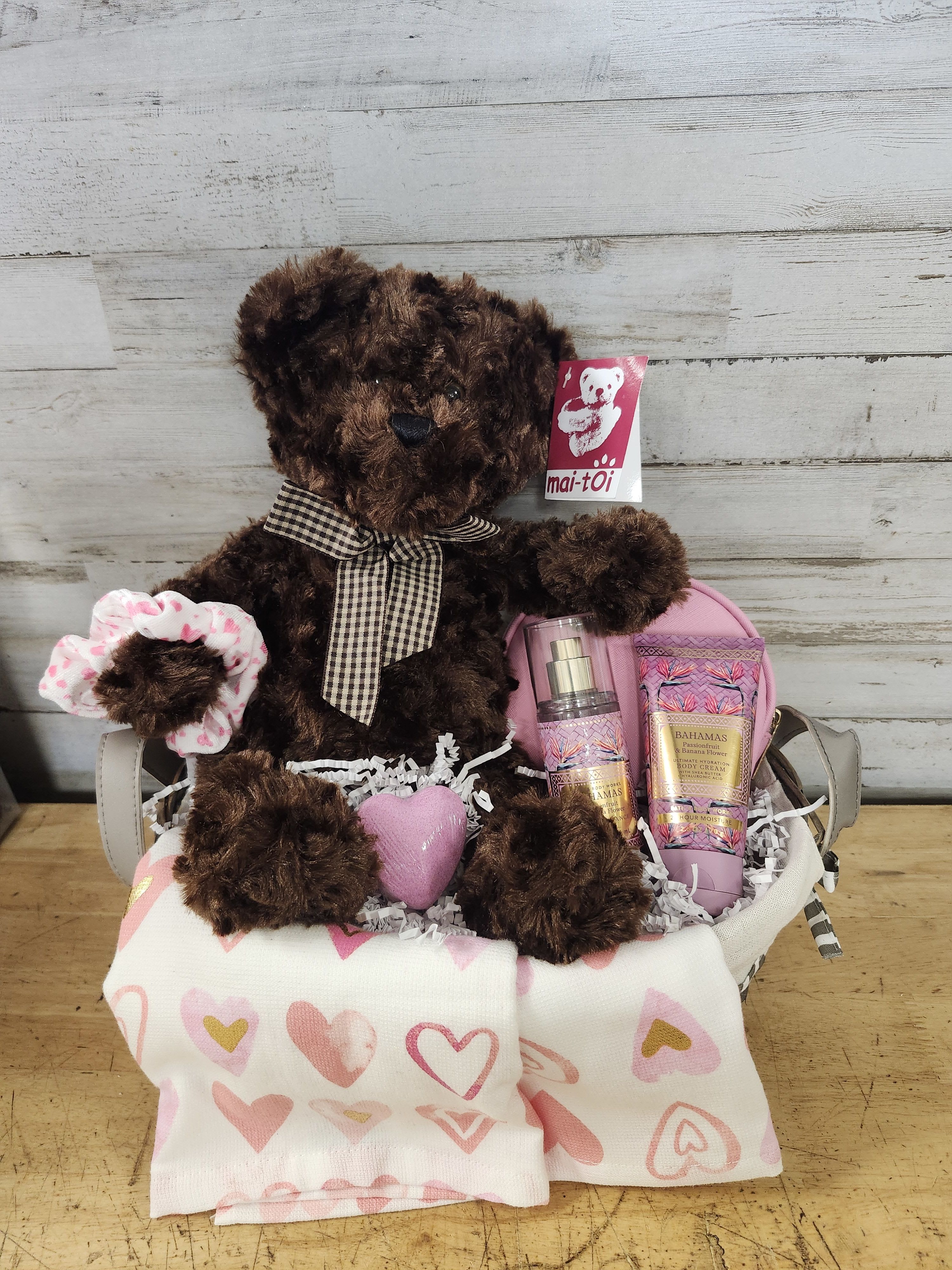 Pink Passion - $80 - Cute little basket in shades of pink, basket contains:  - Watercolor Heart Tea Towel - Makeup Bag - Bahamas Scent - Passionfruit &amp; Banana Flower       - Body Cream      - Fragrance Mist - Bath Bomb - Scrunchie Hair Tie - Curly Hair Teddy Bear