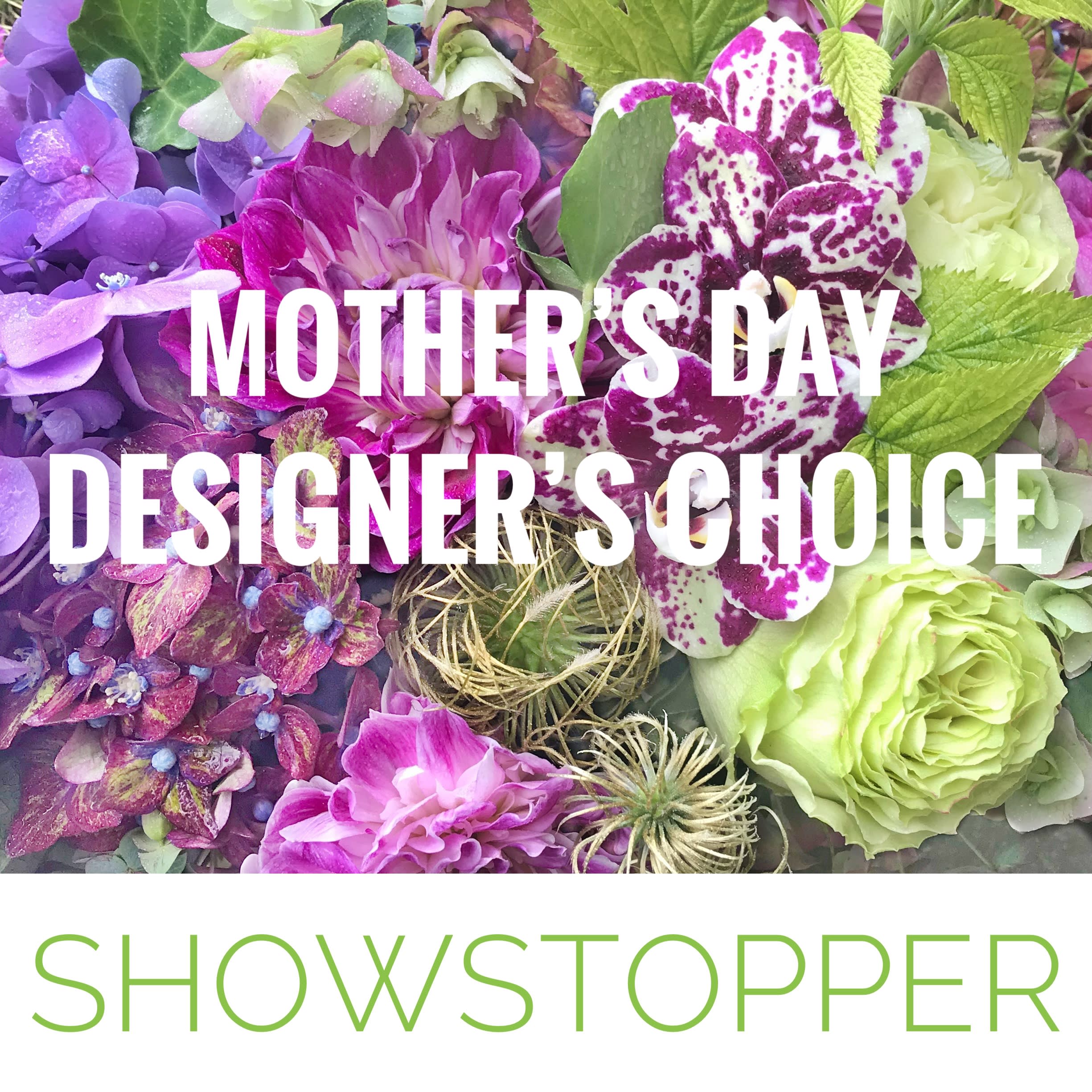 Showstopping Designer's Choice Mother's Day Arrangement - Take the guesswork out of what to send for Mother's Day by letting our designers create a special Mother's Day arrangement in our signature style that is sure to impress. The design team will select from the best of the flowers that we have available and create a perfect expression of your love and appreciation.  If you have any special requests, give us a call so that we can ensure our ability to accommodate them. If you prefer to order online you can note any requests under ‘Special Instructions’ and we will get back to you if we have any questions. We will make every effort to fill your order as requested and will make appropriate substitutions if we are not able to find your first choice.   Deluxe - $300 Premium - $350  The size will vary but the arrangement will be stunning!