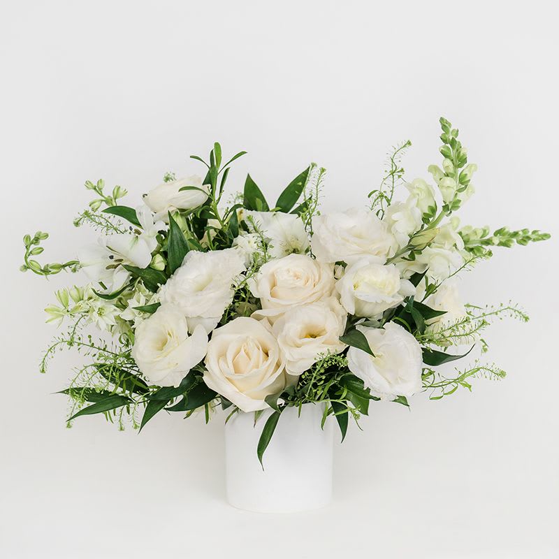 Seasonal  Petite Arrangement - Neutral - Our Petite Seasonal Arrangement features pretty neutral seasonal blooms, making it the perfect floral gift for birthdays, or any time you need a little pick-me-up. Featured in Brooklyn White Ceramic Vase 3.5" 