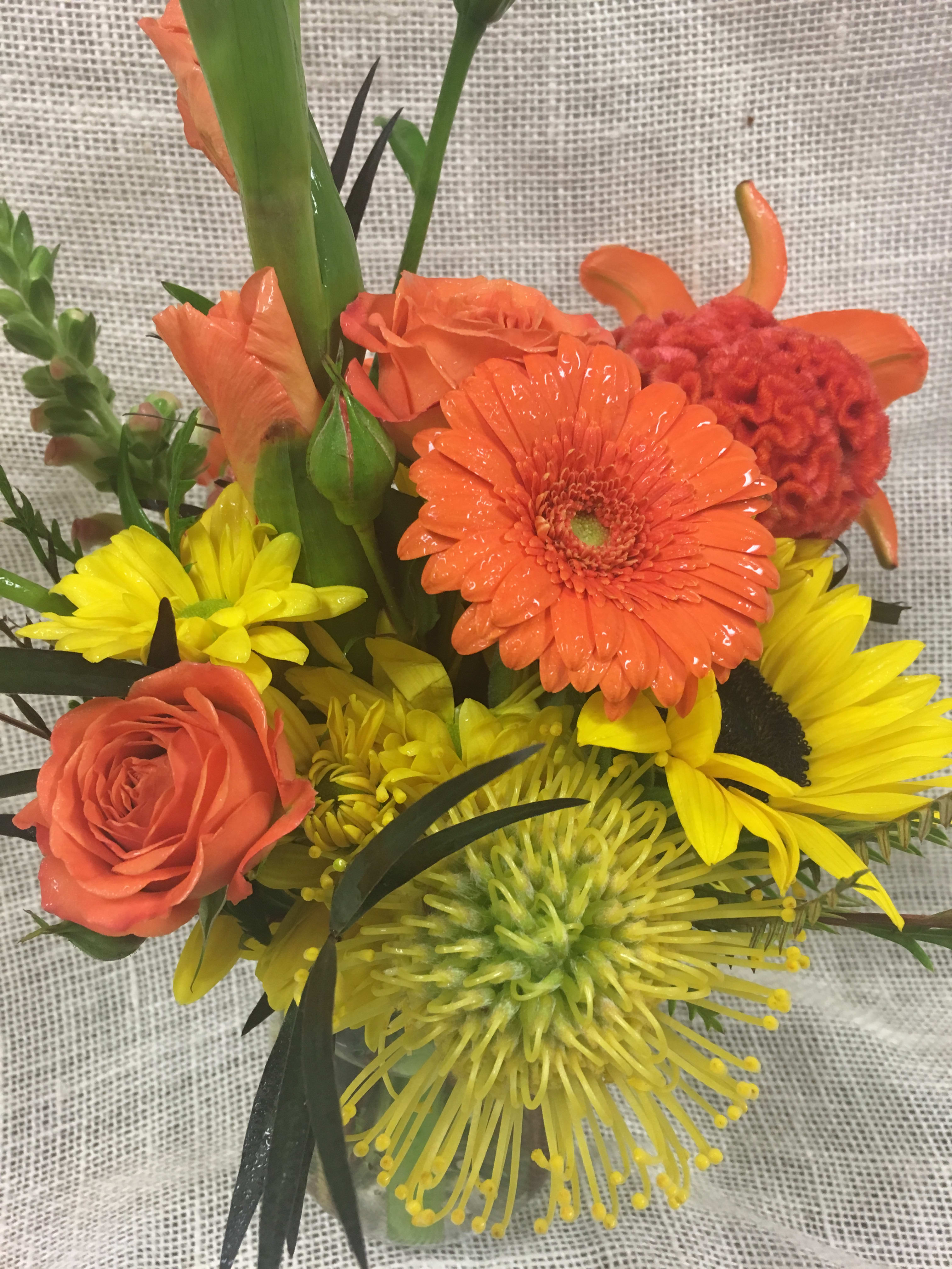 Orange and yellow mixed bouquet with roses, gerbera daisies, and spider mums