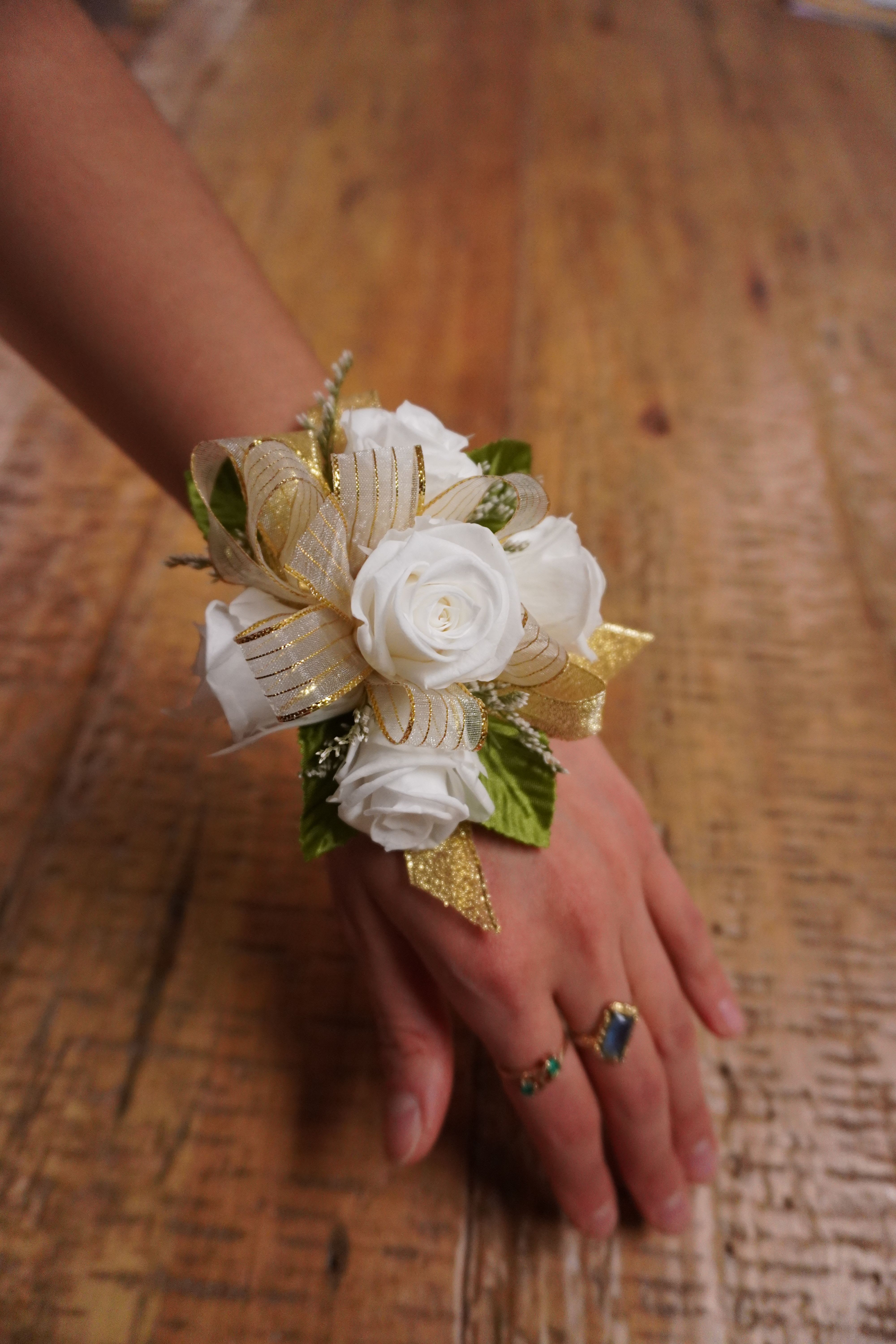 Preserved Rose Corsage Keepsake - A cluster of REAL preserved roses accented with ribbon. This corsage is one you can cherish for a lifetime made with roses that are meant to last. Our preserved roses range from white, red, light pink, dusty rose, and cream. Choose your choice of color rose and ribbon. Create a time capsule of an unforgettable night! *Provide corsage details at checkout*
