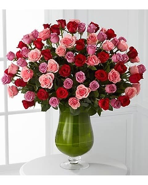 Heartfelt Luxury Bouquet - They unlock your every emotion. They will always make your heart skip a beat. Offer your heartfelt love with an abundance of our finest 24" premium roses. These extraordinary red, pink and lavender roses display their large heads with high petal counts in a 16-inch clear glass pedestal vase, creating the perfect symbol of your love.  