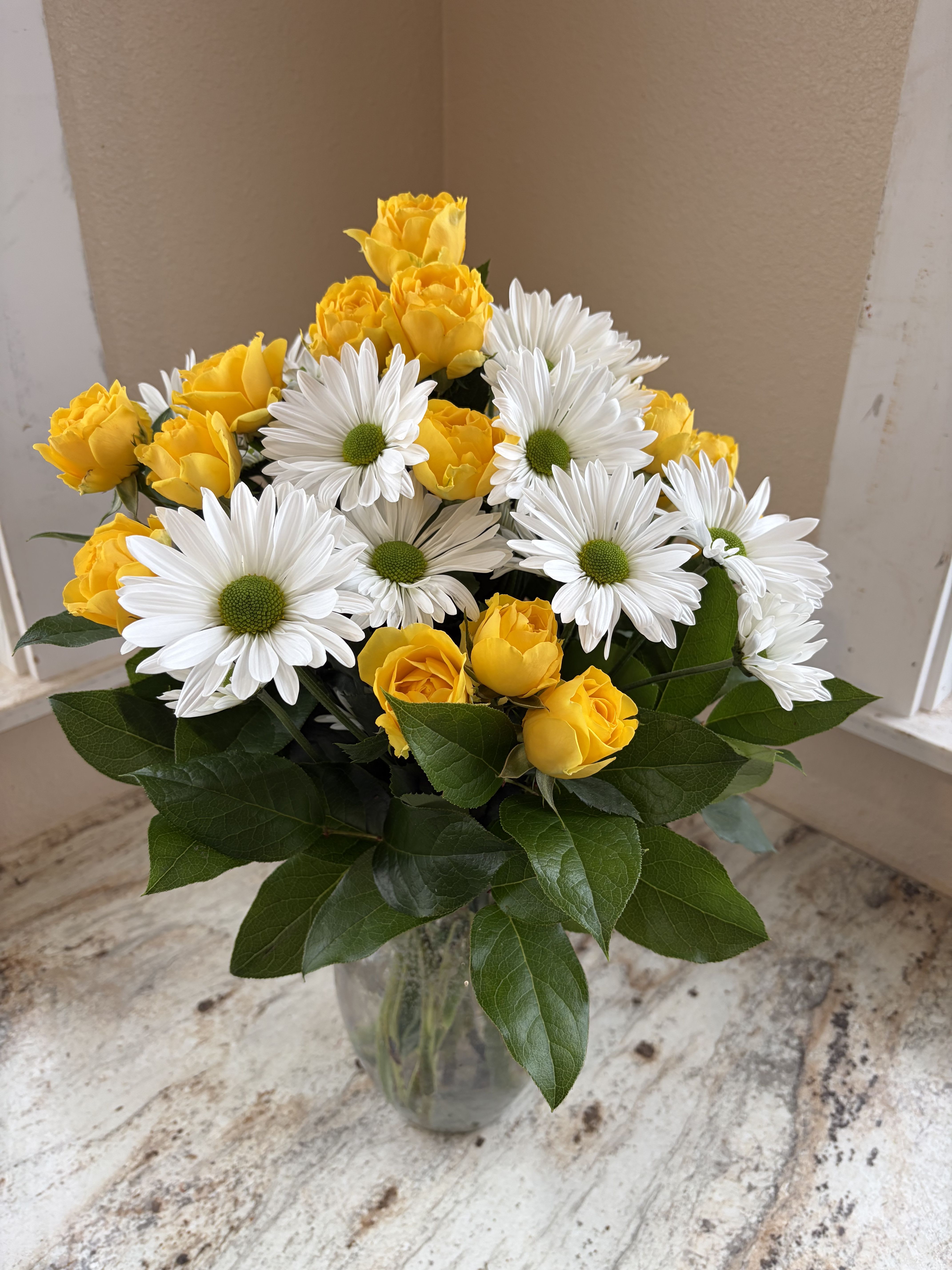 Sunshine Promise - Cheery yellow Spray Roses and Happy Daisies to bring cheer!