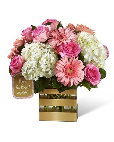Love Bouquet - Bringing together pink roses and pink gerbera daisies, surrounded by clouds of white hydrangea and accented with lush greens, this fresh flower arrangement has a unique style and grace your special recipient will adore. Presented in a chic rectangular clear glass vase accented with modern gold stripes and presented with a unique Hallmark tag that states, "Love. Be Loved. Vase will be substituted if original is not avaviable  