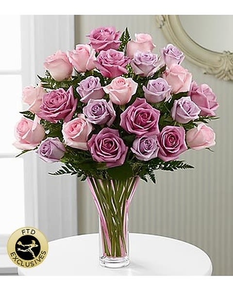 Mixed Rose Bouquet - Mother's Day Mixed Rose Bouquet is a delightful way to show how much mom means to you on her special day! An assortment of roses in an array of brilliant blushing hues, including pink, lavender and light purple are brought together to form an exquisite flower arrangement. Presented in a designer pale pink glass vase, this exquisite rose bouquet will convey your every emotion of gratitude and appreciation to the woman who has alwasy been by your side. Standard 18 roses Deluxe 24 roses Premuim 36 roses  