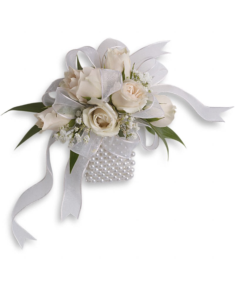 White rose wrist corsage with sheer ribbon bows and a pearl bracelet band