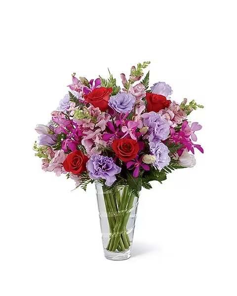 Perfect Impressions - We proudly present the Vera Wang Perfect Impressions™ Bouquet. Blooming with the finesse and charm that Vera Wang brings to every design, this flower bouquet is a delightful expression of love and appreciation. Rich red roses, fuchsia Mokara orchids, lavender double lisianthus and pink snapdragon stems are accented with lush greens to create a simply fantastic flower arrangement. Presented in a superior modern clear glass vase, this mixed flower bouquet will make that perfect impession to celebrate any of life's special occasions, creating a sensation on Mother's Day, a birthday, anniversary, or as a way to extend your congratulations wishes. 