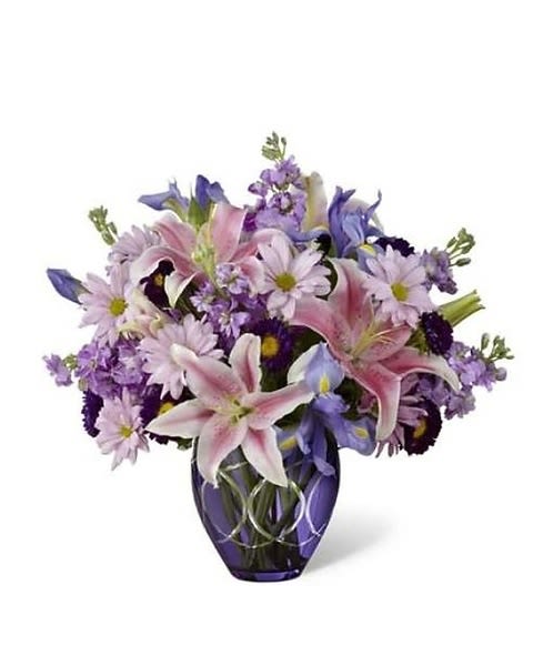 Radiant - Radiant™ Bouquet makes an inspired use of harmonizing and contrasting hues to color Mother's Day perfectly lovely for mom. Soft pink Oriental Lilies, ruffled columns of lavender gilly flowers, deep blue irises, lavender daisies, purple matsumoto asters and lush greens create a simply stunning arrangement in a deep purple glass vase encircled all around with sparkling, brilliant cuts. Besides making an excellent Mother's Day gift, this elegant bouquet can give a special lift to birthdays and anniversaries, or to send your "Thank You", "Get Well", and "Congratulations". 