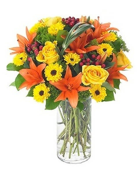 Sophistication - Send a sunny siesta someone's way with this chic summer bouquet! Warm shades of orange and yellow are presented in a modern vase for a stylish arrangement that suits anyone, any time. 