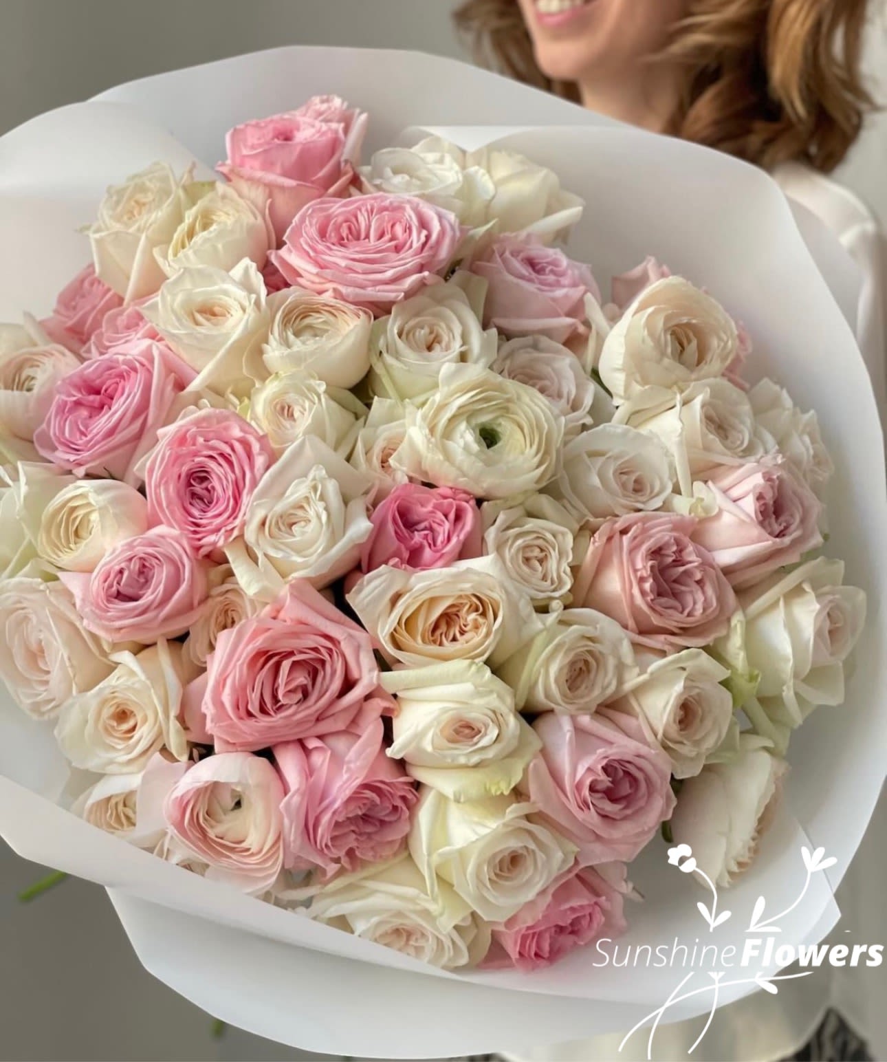 Gentle Whisper (51 Roses) - Gentle Whisper is a refined and elegant bouquet composed of 51 premium white and blush pink roses, carefully selected for their freshness, beauty, and graceful presence. This arrangement captures a delicate balance between purity and romance, where soft white tones meet gentle shades of pink, creating a harmonious and sophisticated composition. Each rose is thoughtfully arranged to form a lush, full silhouette that feels both luxurious and effortless. The bouquet speaks in a quiet, graceful language — not bold, but deeply expressive — making it perfect for meaningful moments, heartfelt gestures, and timeless celebrations. Gentle Whisper is designed for those who appreciate subtle beauty, softness, and emotional depth. Whether it’s a romantic surprise, a special occasion, or simply a desire to bring elegance into someone’s day, this bouquet delivers a feeling of calm warmth and refined charm. Its classic palette and generous size make it a standout piece while still maintaining a light, airy character — a true expression of understated luxury.