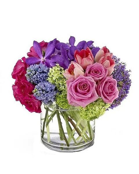 Spring Oasis - Like an oasis of calm sent to soothe a hectic life, this gentle spring bouquet – created in a soft palette of purples, pinks and greens – will add a beautiful touch to any décor. This chic floral arrangement makes an impressive gift… or why not send it to yourself as a special treat? 