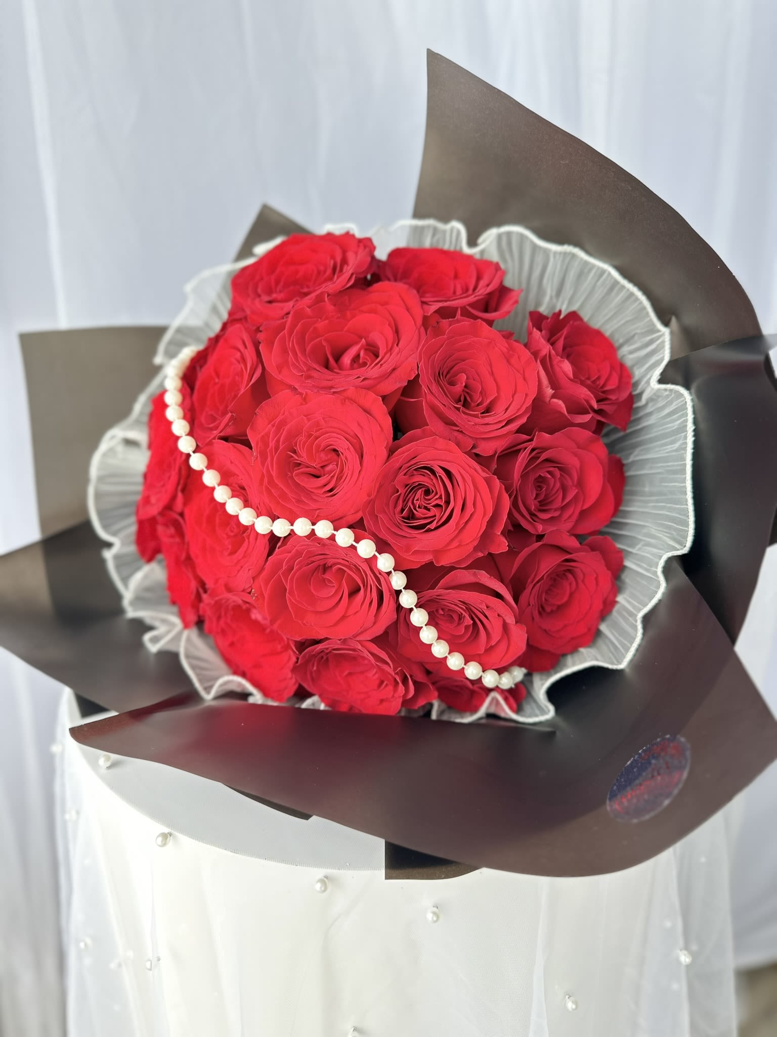 Timeless Love Bouquet - At the heart of this stunning bouquet lies a delicate chain of pearls, gracefully draped to add a touch of timeless sophistication and charm.  Perfect for anniversaries, romantic gestures, or any occasion where you wish to express your deepest feelings, Timeless Love Bouquet is more than just a gift; it is a statement of love and elegance.