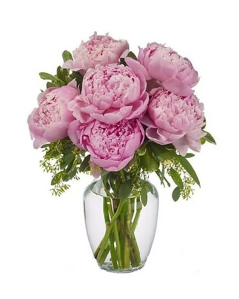 Pink peony bouquet arranged in a clear glass vase