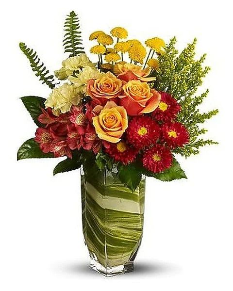 Cosmic Blooms - A burst of brilliant flowers in a clear glass vase lined with a spiraling leaf inside - a design that creates an exhilarating sense of movement that will make their spirits soar! 