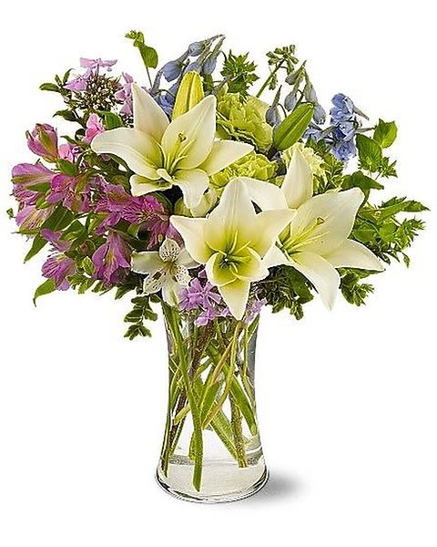 Heavenly Hamptons - Dream of days spent in a house by the ocean – a heavenly breeze drifts by, carrying the fragrance of garden flowers. This casual summer bouquet of white lilies and purple and green blooms is just right for any occasion. 