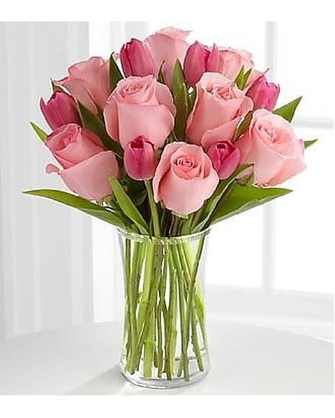 Pink Poise - The Pink Poise Mother's Day Bouquet sweetly offers a soft expression of Spring beauty. Our finest pale pink roses are matched with bright pink tulips to create a bouquet that conveys your special message of love to Mom of love and endless appreciation with each blushing bloom. 