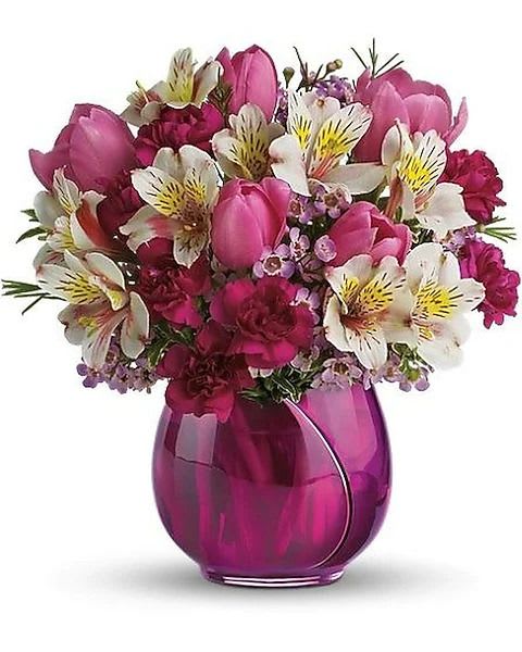 Be My Sweetheart - Surprise her with a delightfully different Valentine's bouquet featuring hot pink tulips in a beautiful vase that looks like a tulip. It's fresh, contemporary and totally gorgeous. Expect kisses. This vase is currently sold out and will be substituted with a similar styles vase