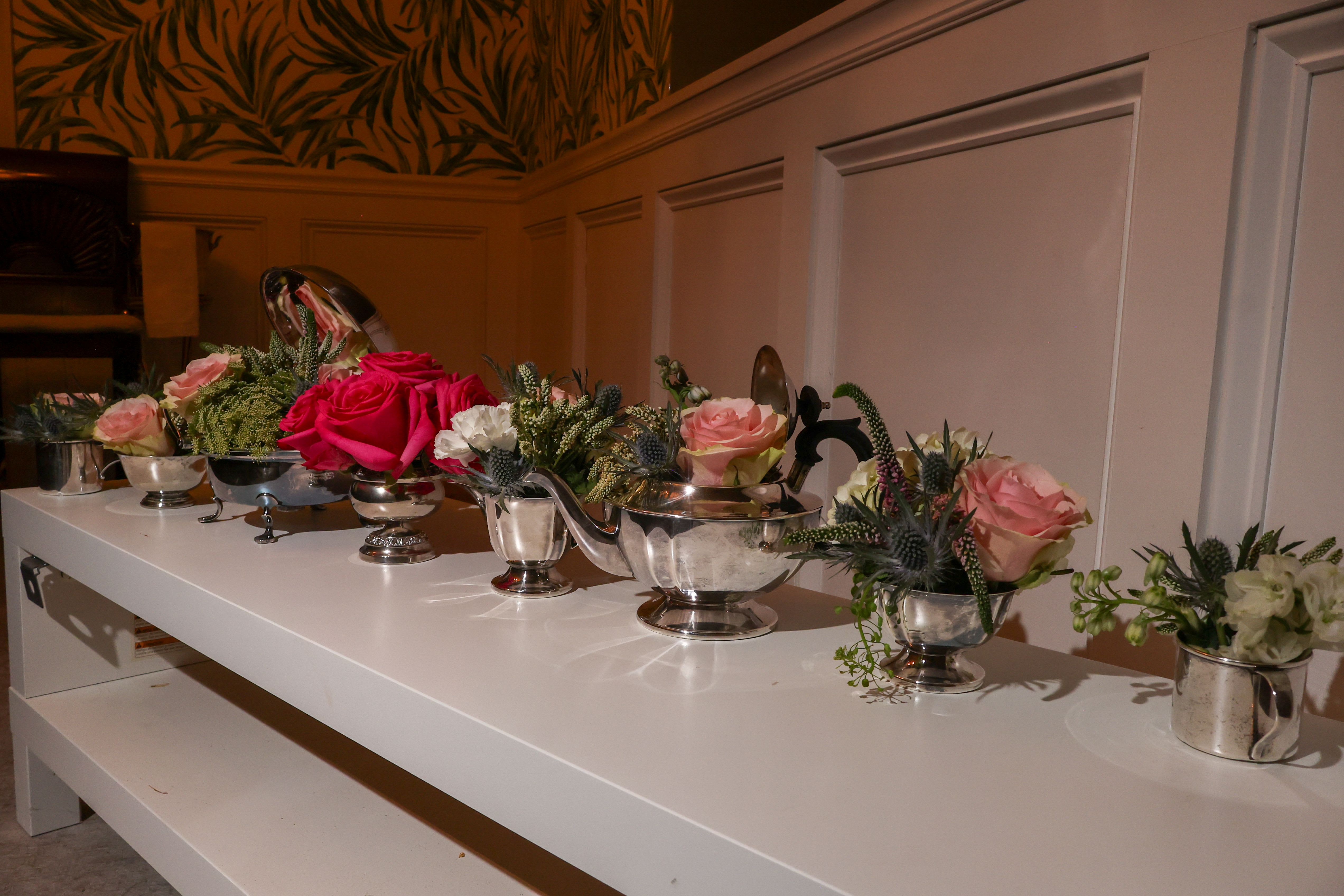 Display your Family Heirlooms - $140 dollars  includes a consult and pick up, the cost of flowers are additional. What a splendid way to utilize Great Grandmas, silver or other items, perfect for baby/Bridal showers or any event