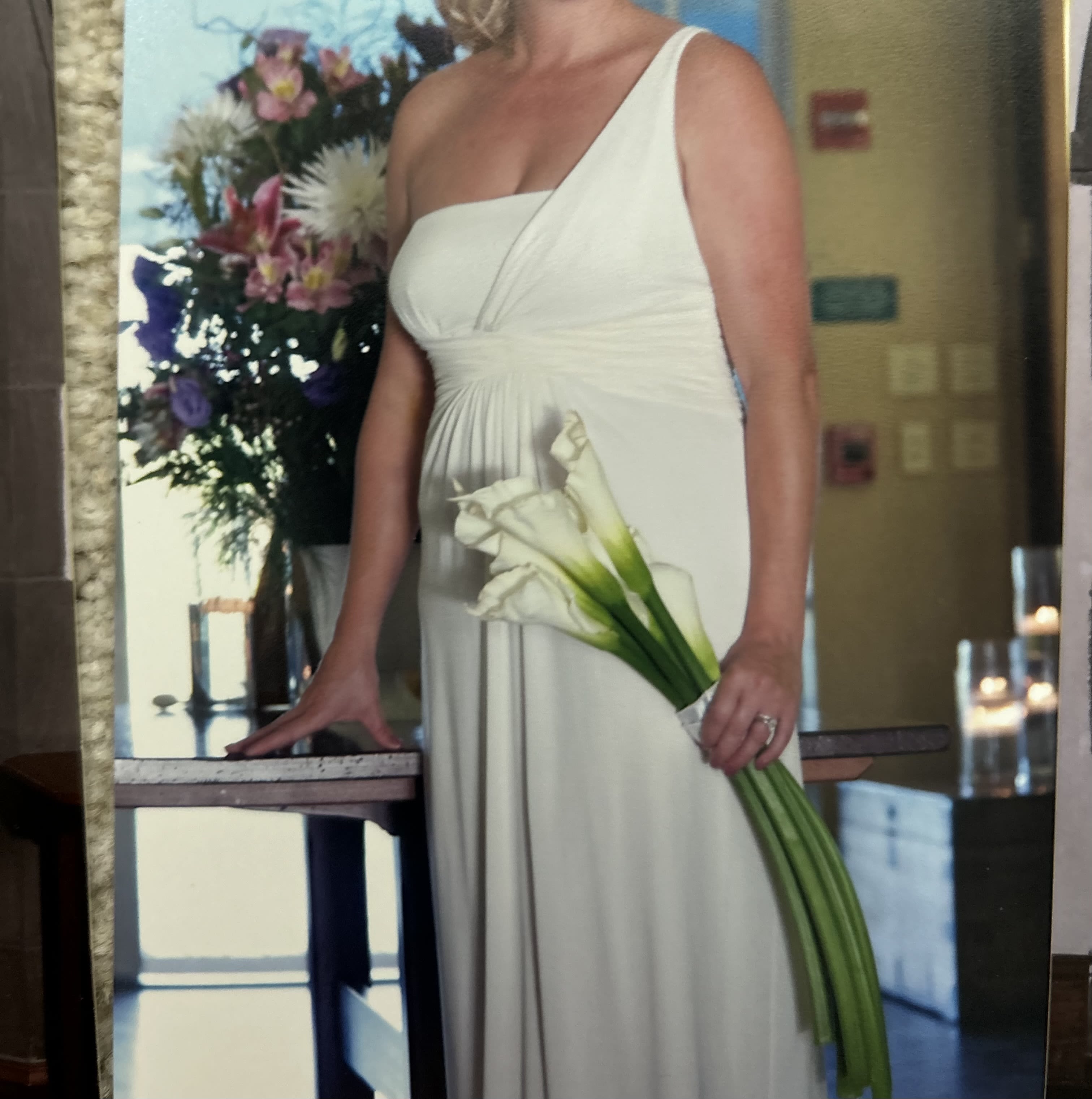 Tied bouquets - Bouquets can start as low as $60 and go up depending on choice, season and amount. Pictured here long stem Calli Lilies as priced. Wedding always encouraged to please call.