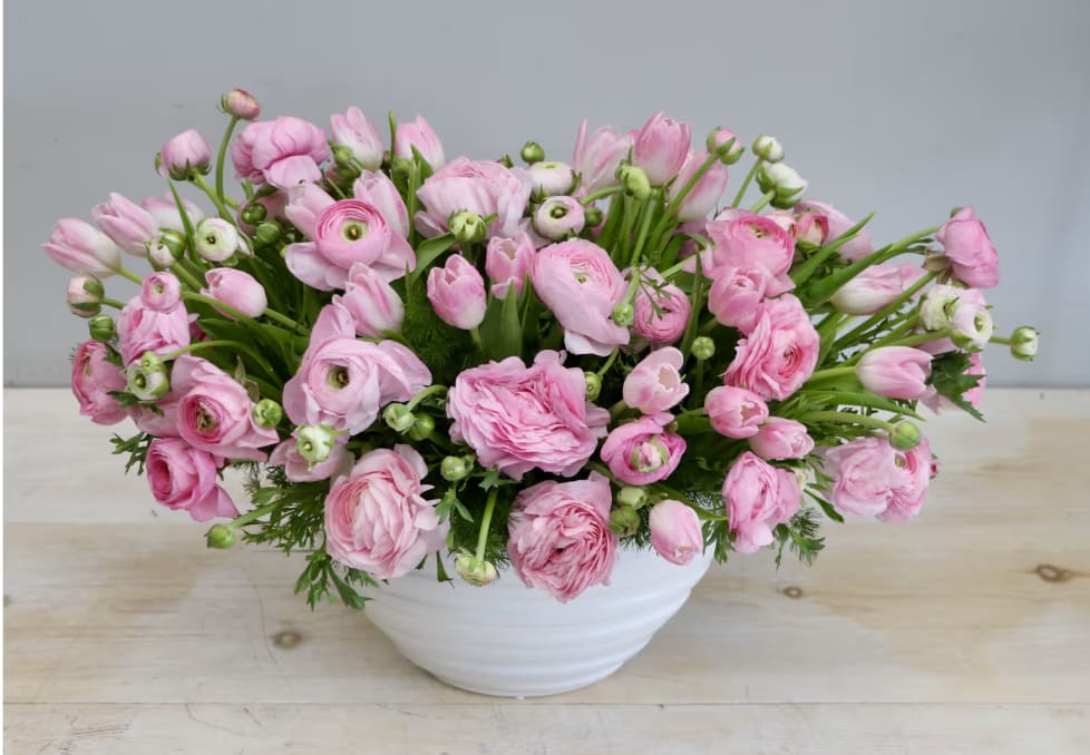 Tickled Pink - WeHo  - Pink is the theme of this gorgeous arrangement! We paired together ranunculus and tulips for a sweet look. The arrangement shown is in the standard size, don't forget to upgrade for more blooms!