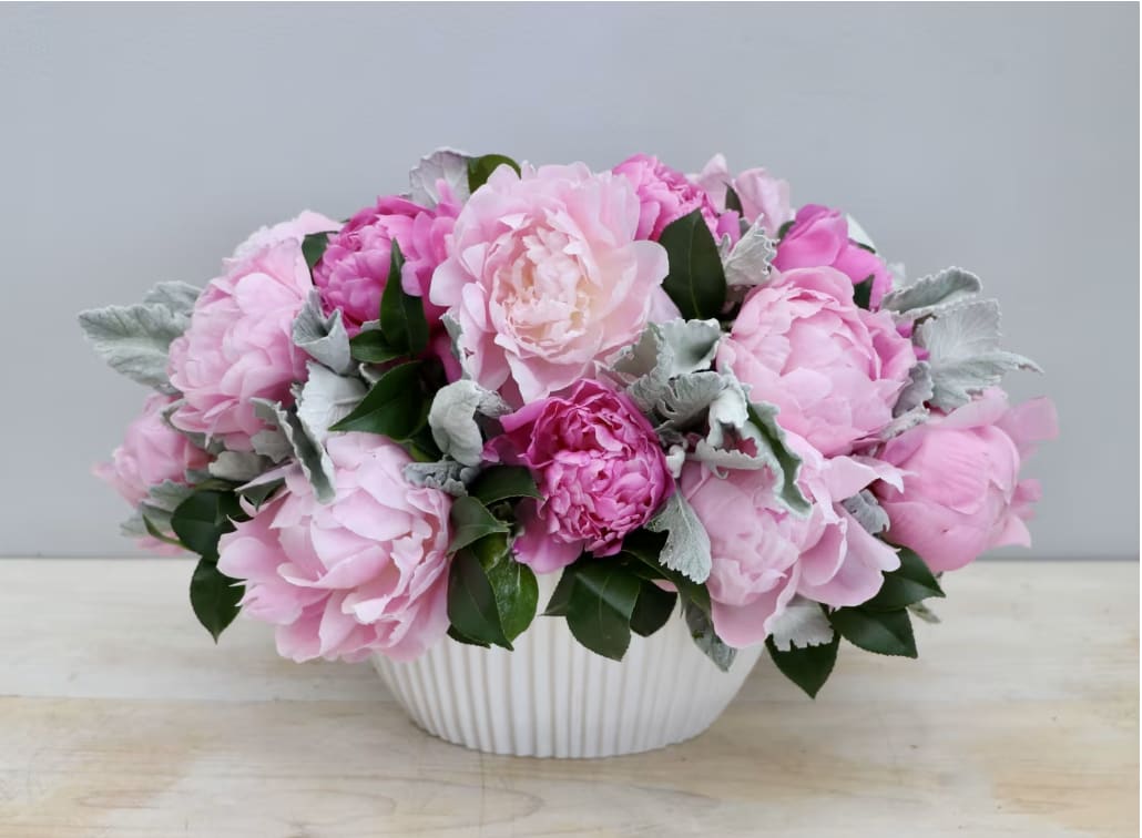 Peony Enchantment - WeHo - Back in season just in time for the holidays, this beautiful arrangement of pink peonies will bring a smile to anyone's face. Make sure to get yours while supplies last. 