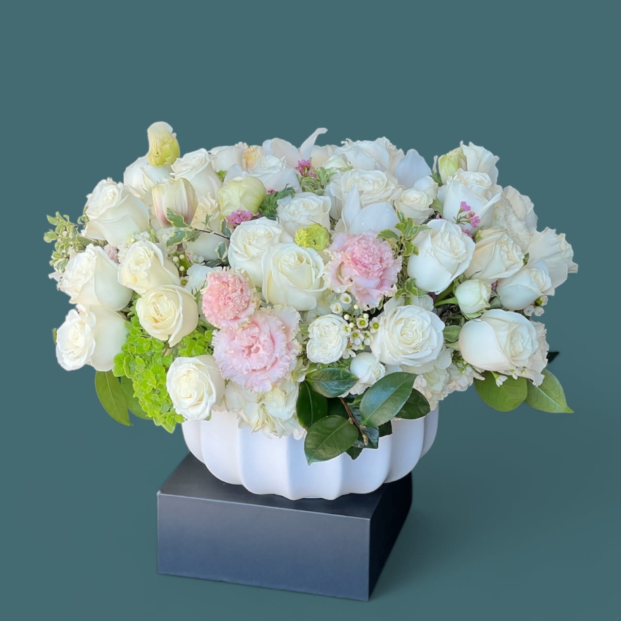Amanda - A wonderful mix of bright white Roses in a bed of Hydrangea, with soft pink blooms such as Lisianthus
