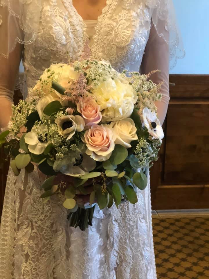The Stunner Bridal Bouquet - Say "I Do" with Blush roses, white roses, anemones, queen anne's lace, and pink astilbe with fresh eucalyptus wrapped in a silk ribbon. Availability: Peonies available March- June, November- January  Must be ordered at least 5 days before event.