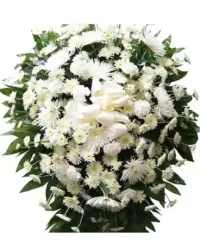 Standing spray of white chrysanthemums and daisies with a white bow