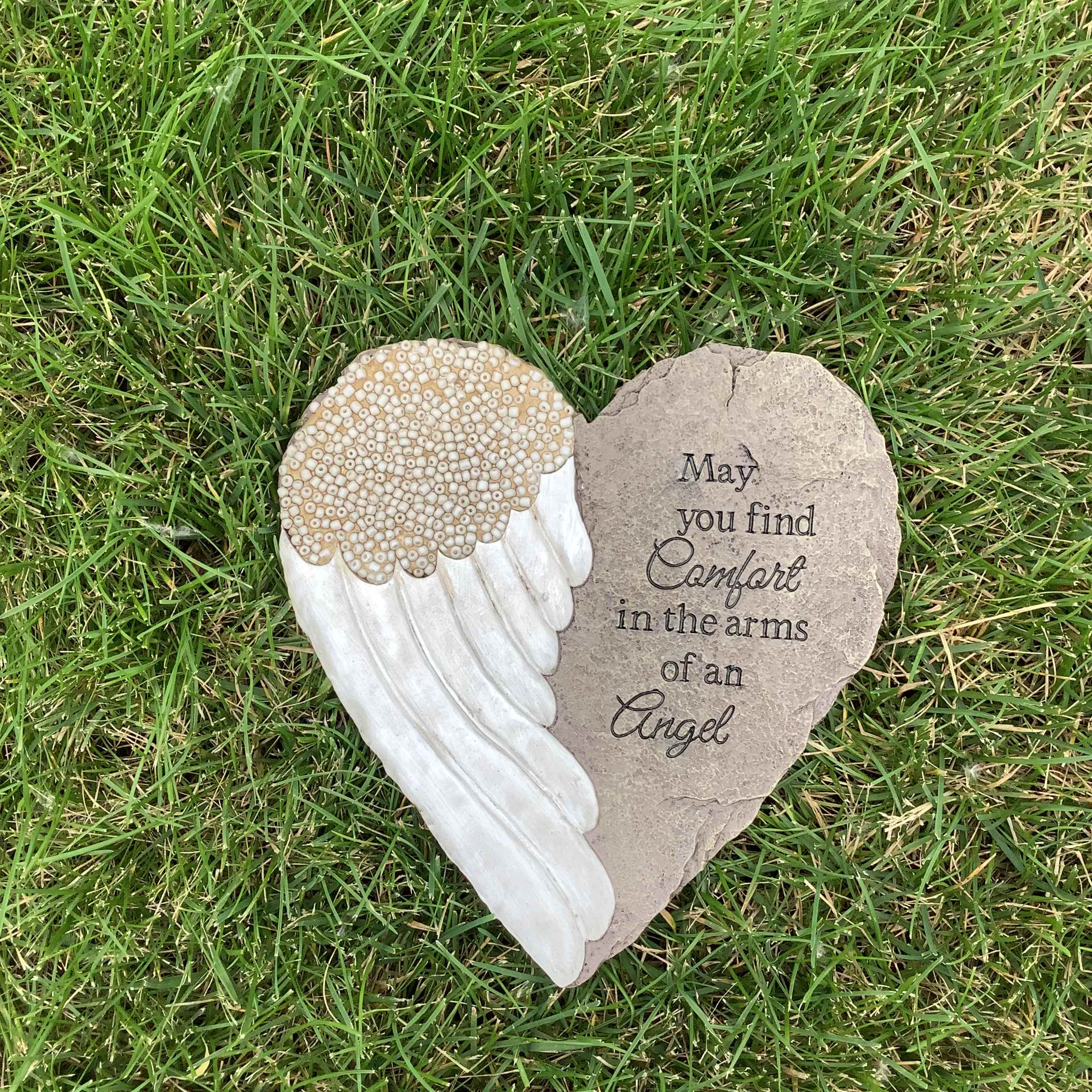 Stepping Stone - Comfort - Our memorial garden stones serve as a touching tribute to those who have passed. Express your sympathy with this polyresin stepping stone featuring the phrase “May you find comfort in the arms of an angel”. It measures 9” wide x 110” high. 