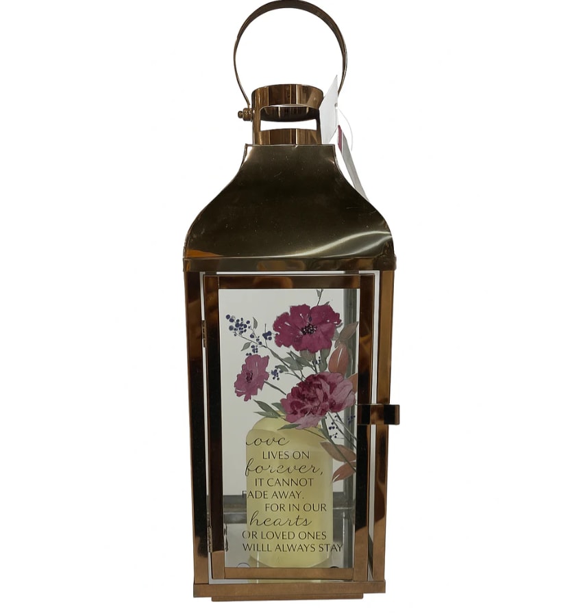 Bronze lantern with a floral memorial insert and quote