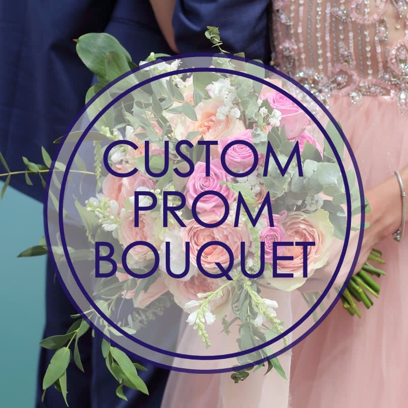 Round bouquet of pink and white roses held by a couple in prom attire