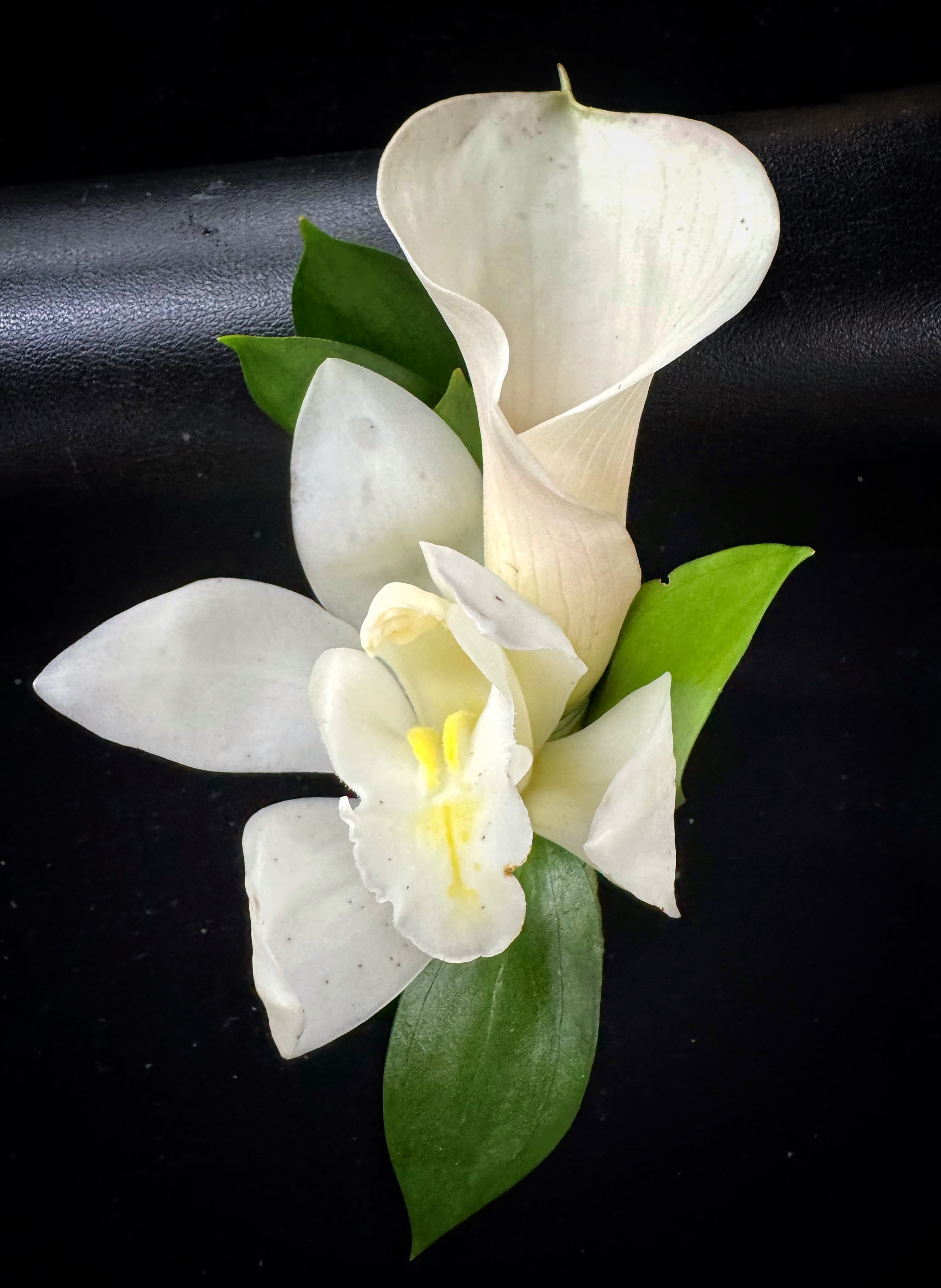 Men's Boutonniere- calla and orchid - A miniature cymbidium orchid and a mini calla lily with foliage.