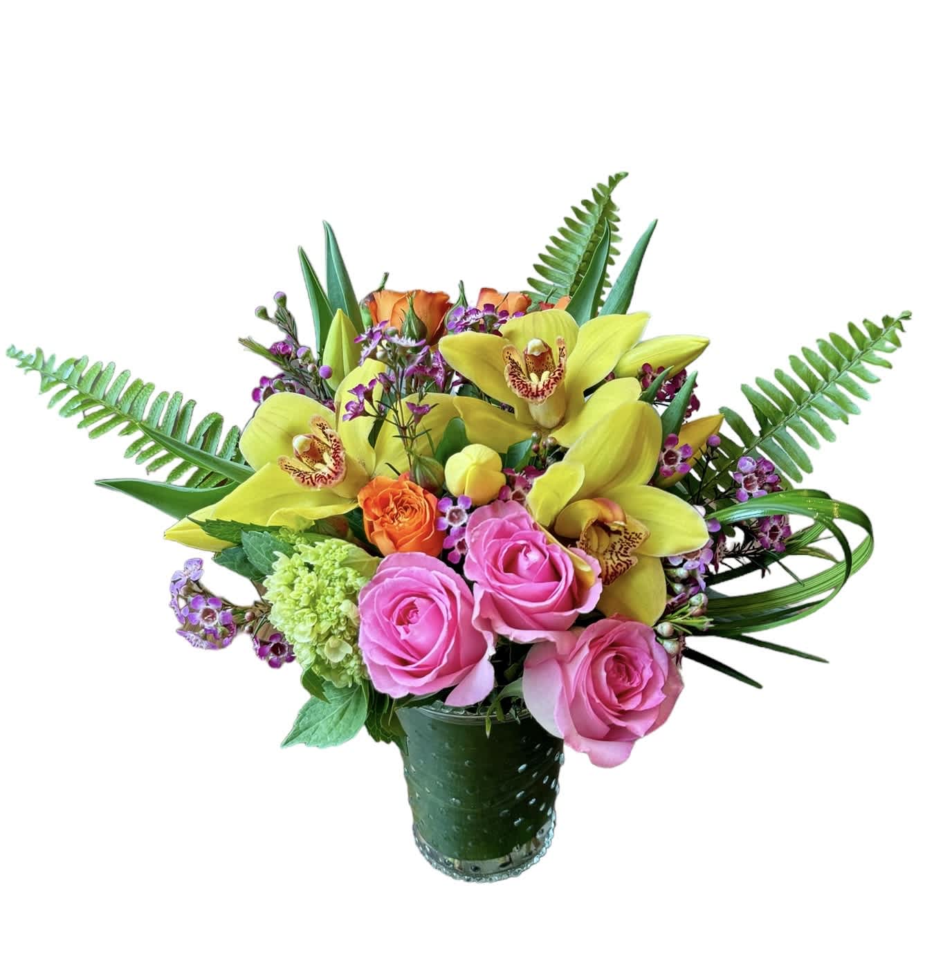 Colorful arrangement of yellow orchids and pink roses in a clear glass vase