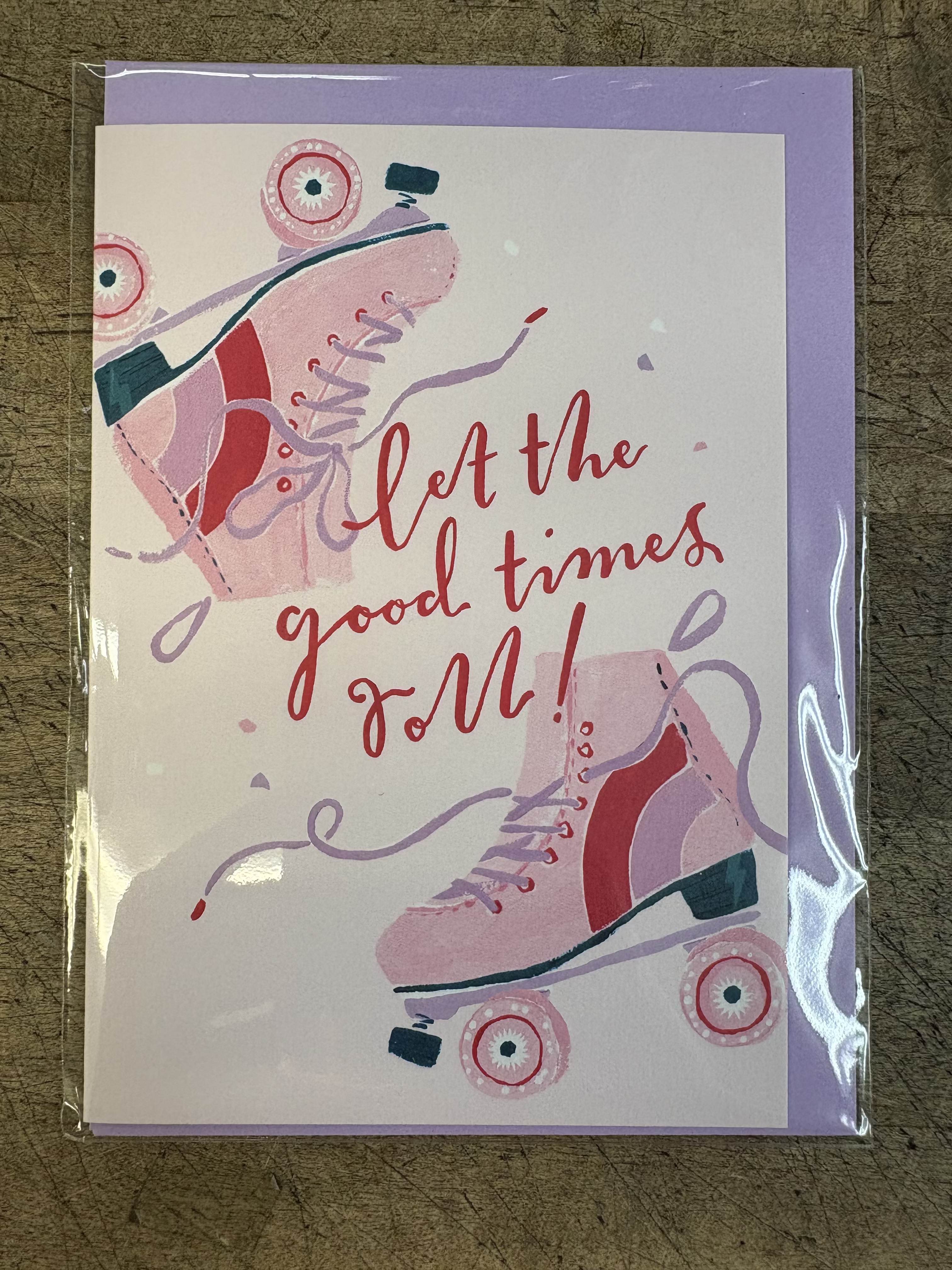 Greeting card with pink roller skates and the words let the good times roll in red script